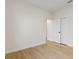 Bedroom with light hardwood flooring, closet and neutral paint, creating a peaceful atmosphere at 12531 Blazing Star Dr, Tampa, FL 33626