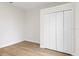 Empty bedroom featuring double closet and new flooring at 12531 Blazing Star Dr, Tampa, FL 33626