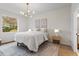 Calm bedroom showcasing a large window and neutral color palette at 12531 Blazing Star Dr, Tampa, FL 33626