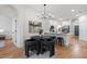 Open dining area with view to the kitchen with stainless steel appliances and island seating at 12531 Blazing Star Dr, Tampa, FL 33626