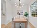 Bright dining area featuring a stylish chandelier and ample seating with natural light at 12531 Blazing Star Dr, Tampa, FL 33626