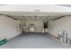 Spacious garage with painted floors, providing ample space for parking, storage, and projects at 12531 Blazing Star Dr, Tampa, FL 33626
