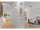 Open hallway with arched doorways leading to a bright living room and modern kitchen at 12531 Blazing Star Dr, Tampa, FL 33626