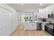 Modern kitchen features stainless steel appliances and ample counter space at 12531 Blazing Star Dr, Tampa, FL 33626