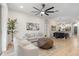 Open concept living room with stylish decor and seamless flow to the kitchen at 12531 Blazing Star Dr, Tampa, FL 33626