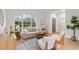 Bright living room with large windows, light neutral colors, and contemporary furniture at 12531 Blazing Star Dr, Tampa, FL 33626