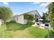 Spacious backyard includes a well-maintained lawn and a relaxing pool area at 13135 Plantation Ter, Seminole, FL 33776