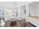 Dining area featuring a round table, white chairs, and a chandelier at 13135 Plantation Ter, Seminole, FL 33776