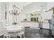 Spacious eat-in kitchen with dark hardwood floors, stainless steel appliances, and lots of natural light at 13135 Plantation Ter, Seminole, FL 33776