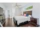Spacious main bedroom with dark wood floors and a bright window view at 13135 Plantation Ter, Seminole, FL 33776