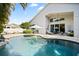 Relax by the pool with spacious patio and lush landscaping at 13135 Plantation Ter, Seminole, FL 33776