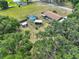 Aerial view showing pool and outbuildings at 13208 Sydney Rd, Dover, FL 33527
