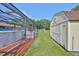Yard between the home, pool, and shed at 13208 Sydney Rd, Dover, FL 33527