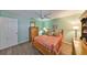 Cozy bedroom with wood furniture, ceiling fan, and ample natural light at 13208 Sydney Rd, Dover, FL 33527