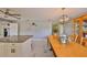 Open dining area connects kitchen, featuring light fixture and a wooden table at 13208 Sydney Rd, Dover, FL 33527
