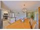 Inviting dining area with a kitchen view, ideal for entertaining guests at 13208 Sydney Rd, Dover, FL 33527