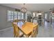 Cozy dining area features a chandelier, white cabinets and seating at 13208 Sydney Rd, Dover, FL 33527