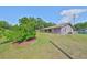 Charming single-story home with a well-maintained lawn and vibrant landscaping at 13208 Sydney Rd, Dover, FL 33527
