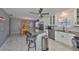 Well-lit kitchen with stainless steel appliances and a center island with seating at 13208 Sydney Rd, Dover, FL 33527