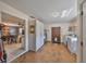 Spacious laundry room with storage cabinets and access to other rooms at 13208 Sydney Rd, Dover, FL 33527