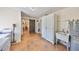 Functional laundry room with storage cabinets and modern appliances at 13208 Sydney Rd, Dover, FL 33527