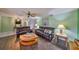 Spacious living room featuring hardwood floors and comfortable sofas at 13208 Sydney Rd, Dover, FL 33527