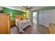 Inviting main bedroom with a ceiling fan and adjacent bathroom at 13208 Sydney Rd, Dover, FL 33527