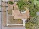 Aerial view of home with backyard patio and a new roof surrounded by lush, mature landscaping at 1401 49Th N St, St Petersburg, FL 33710