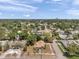 An aerial view of a charming home nestled among mature trees in a quiet neighborhood at 1401 49Th N St, St Petersburg, FL 33710