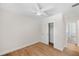 Clean bedroom with light wood floors and white sliding-door closet at 1401 49Th N St, St Petersburg, FL 33710