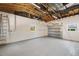 Spacious garage with epoxy flooring, tall ceilings, and windows for natural light at 1401 49Th N St, St Petersburg, FL 33710