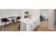 Bright, open kitchen features white cabinets, stone countertops, and stainless appliances open to living and dining areas at 1401 49Th N St, St Petersburg, FL 33710