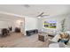 Spacious open-concept layout with hardwood floors and white walls that connect the living room and dining area at 1401 49Th N St, St Petersburg, FL 33710