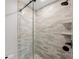 Detailed view of the shower with glass doors and modern showerhead at 1401 49Th N St, St Petersburg, FL 33710