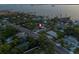 Gorgeous aerial shot of waterfront property with private pool in residential neighborhood near open water at 1542 Bayshore Blvd, Dunedin, FL 34698