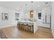 Bright, open kitchen with marble countertops, stainless steel appliances, and center island with seating at 1542 Bayshore Blvd, Dunedin, FL 34698