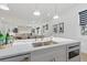Bright kitchen showcasing a large island sink, built-in microwave, and open layout at 1542 Bayshore Blvd, Dunedin, FL 34698