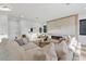 Bright living room featuring a modern fireplace and ample seating, perfect for entertaining or cozy nights in at 1542 Bayshore Blvd, Dunedin, FL 34698