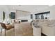 Bright living room featuring modern decor, large windows, and a striking fireplace, perfect for relaxing or entertaining guests at 1542 Bayshore Blvd, Dunedin, FL 34698