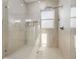 Spacious walk-in shower featuring glass doors, tile surround and dual shower heads at 1542 Bayshore Blvd, Dunedin, FL 34698