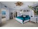 Serene bedroom with an elegant bed, ample natural light, and seamless transition to a cozy seating area at 15630 N Himes Ave, Tampa, FL 33618