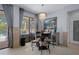 Cozy dining area with chandelier, modern decor, and access to outdoor pool and patio at 15630 N Himes Ave, Tampa, FL 33618