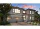 Stunning two-story home with a two-car garage, lush landscaping, and a beautiful entryway at 15630 N Himes Ave, Tampa, FL 33618