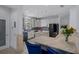 Well-equipped kitchen with a large island, stainless steel appliances, granite counters, and custom cabinetry at 15630 N Himes Ave, Tampa, FL 33618