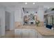 Bright living space with white cabinets, bar seating, and an open layout, perfect for entertaining at 15630 N Himes Ave, Tampa, FL 33618
