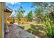 Large, private backyard with lush landscaping and mature trees at 1665 Laura St, Clearwater, FL 33755