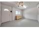 Basement features neutral tones, ceiling fan, and light wood dresser at 1665 Laura St, Clearwater, FL 33755