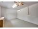 Spacious basement with neutral tones, ceiling fan, and light wood dresser at 1665 Laura St, Clearwater, FL 33755