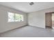 A minimalist bedroom with neutral color palette and a window at 1665 Laura St, Clearwater, FL 33755