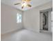 Bedroom with window and doorway leading to another room at 1665 Laura St, Clearwater, FL 33755